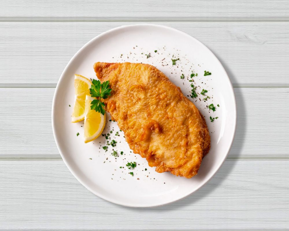 Crumbed fish fillets with chips and salad